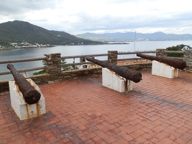 Cannons and the bay of Port de la Selva