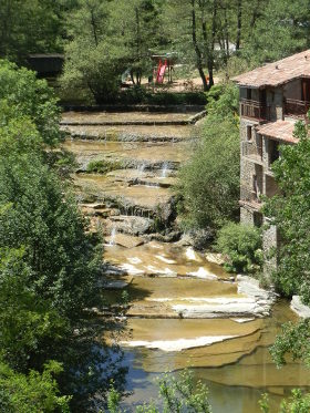 Rupit river through village