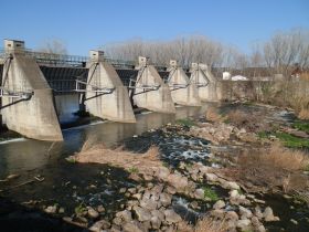 River Ter flood barrier and crossing point near Colomers