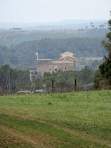 View across to Vilopriu castle on a hazy day